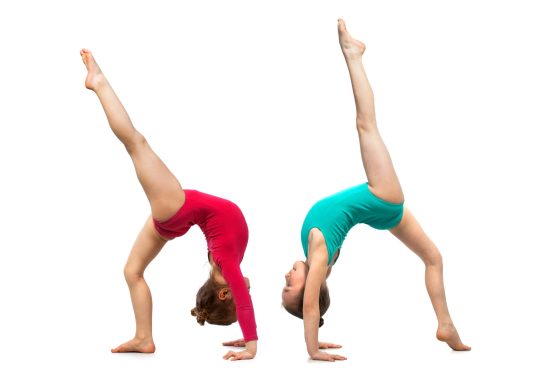 Flexible kids gymnasts, isolated on white background. Sport, active lifestyle concept