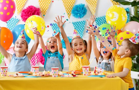 children's birthday. happy kids with cake and ballons