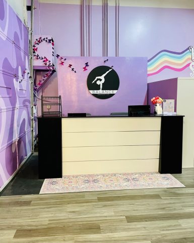 Reception desk with logo and butterlies